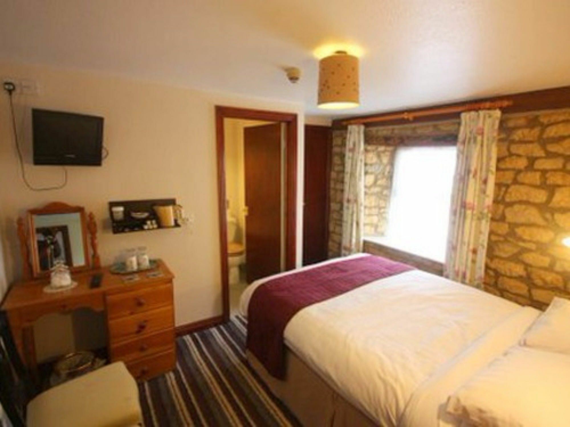 The Lansdowne Guest House Bourton-on-the-Water Exterior foto A room at the Old Inn